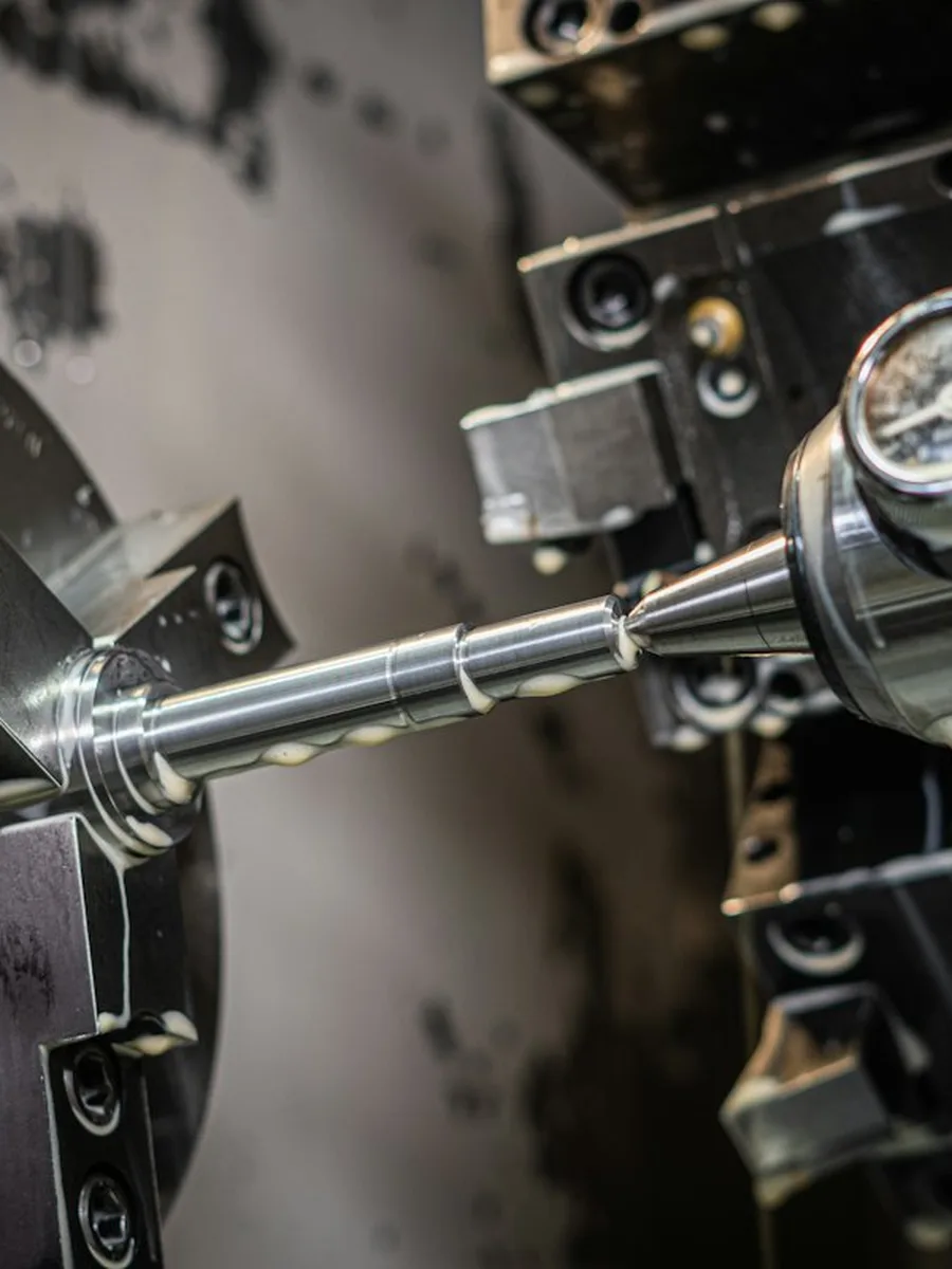 A CNC machine cutting a metal part