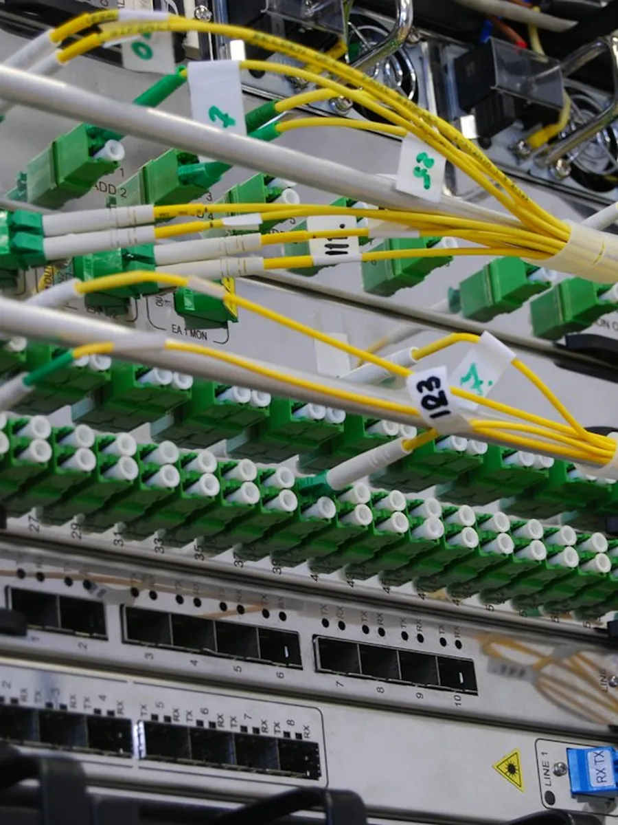 A network switch with fibre cables plugged in